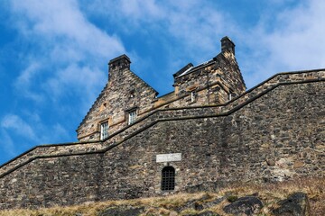 Edinburgh Castle under a blue cloudy sky - Powered by Adobe