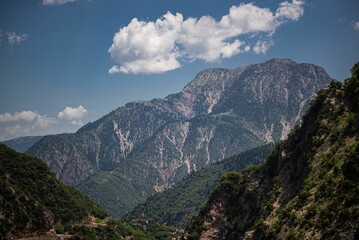 Image of green covered mountains with beautiful sky during daytime - Powered by Adobe
