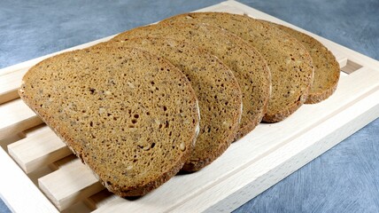 Closeup shot of the slices of brown bread with rye flour