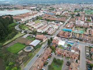 Aerial view of national university of Loja on a sunny day, mountains and sky background
