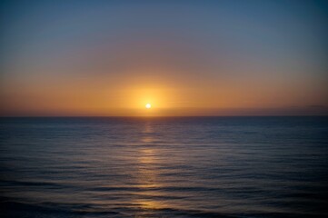 Beautiful shot of a bright sunset sky over the blue sea