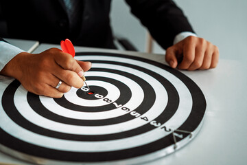 Businessman leader aiming at mission target. Concept of challenge in business marketing bullseye...