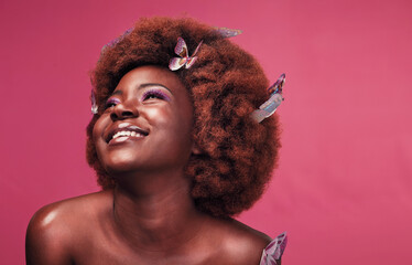 Beauty, smile and black woman with butterflies in studio with creative, art and fantasy. Cosmetics,...
