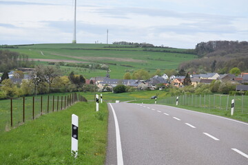 country road into village Mompach, Luxembourg during spring