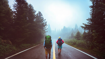 Lover asian man and asian women travel nature. Walk on the road route. traveling nature happily....