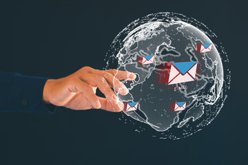 Male hand pointing at globe icon showing dangerous email icon Internet spam emails, hackers