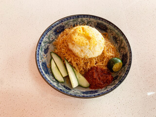 traditional peranakan wok stir fried nonya mee siam noodle spicy chilli shrimp goreng with egg lime...