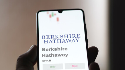 April 09th 2024 , Omaha, Nebraska. Close up on logo of Berkshire Hathaway on the screen of an exchange. Berkshire Hathaway price stocks, $BRK.B on a device. - obrazy, fototapety, plakaty