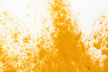 Scattered turmeric powder on white background, turmeric pattern and texture top view - obrazy, fototapety, plakaty