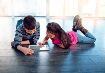 Children, floor and tablet in home for learning or play, education or development with technology....