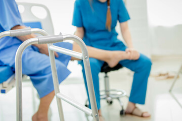 Physical therapy patient With a nurse coming to help do it.