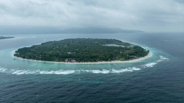 Aerial time lapse of tropical island with beaches and azure blue water at Gili Meno, Lombok, Indonesia