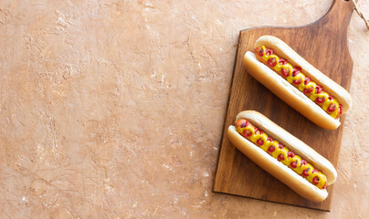 Hot dogs with grilled sausages, ketchup and mustard. Fast food.