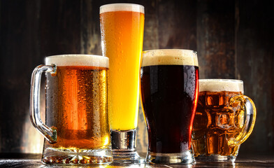 Four glasses with different types of beer