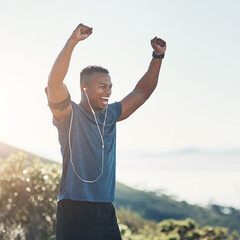Victory, fitness and black man in nature, outdoor and earphones for exercise, training and workout....