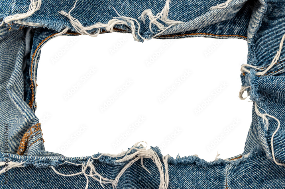 Poster Hole in denim on a white background. Ripped jeans