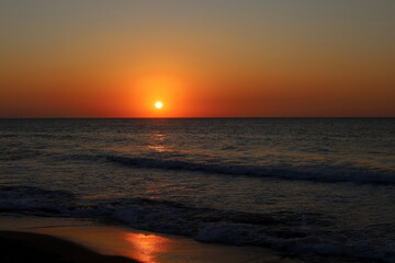 Lighting and color of the sky above the horizon at sunset.