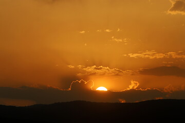 Lighting and color of the sky above the horizon at sunset.