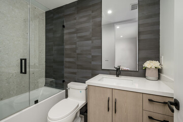 a white bathroom with a stand up shower and tub in the corner