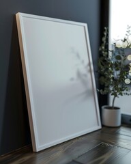 A closeup of a white poster frame mockup standing in a beautiful dark theme home, picture taken from a low perspective, and bokeh background