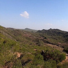 view of the mountains of island Rock Soil and stone Mountains Natural plants Trees Difficult roads Roads Hills Peaks Historic sites Old forts Walls Blue sky Herbs Fog Cold