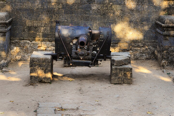 Vintage Cannon five hundred year old Portuguese Guns, made of steel, rusting away at the Diu Fort,...