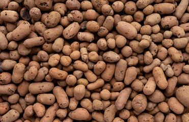 Expanded lightweight clay pebbles background, texture of clay pebbles top view 