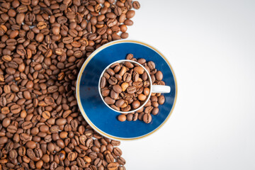 cup of coffee beans with split background empty space 