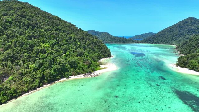 The aerial view of white sand beach tropical with seashore as the island in a coral reef ,blue and turquoise sea Amazing nature landscape with blue lagoon	