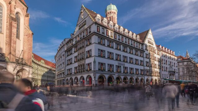 Kaufingerstrasse, shopping street and pedestrian zone in Munich downtown near the Marienplatz timelapse. Panorama of historic buildings with people walking around. Bavaria, Germany