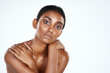 Portrait, skincare and beauty of Indian woman in studio for body wellness isolated on a white...