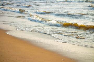 Beach sand and Waves. . The Beautiful Marina Beach, a natural urban beach in Chennai, Tamil Nadu, South India, India, along the Bay of Bengal. the second longest urban beach in the world