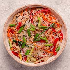 Bowl of rice noodles with vegan soy meat and vegetables. - 783767167