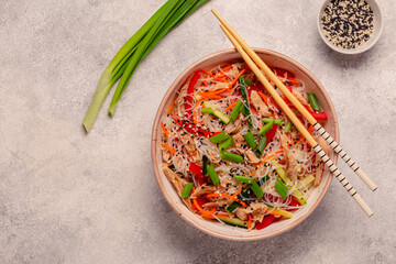 Bowl of rice noodles with vegan soy meat and vegetables. - 783767177
