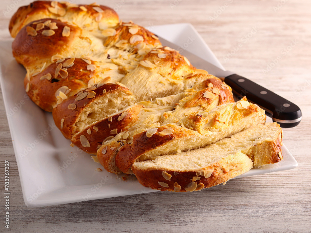 Wall mural freshly homemade braid bread on plate,