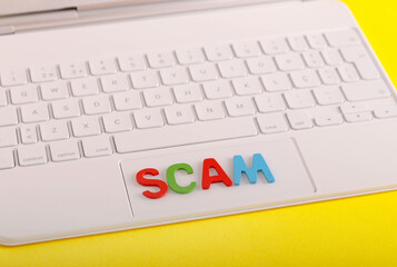 The word – scam – over keyboard