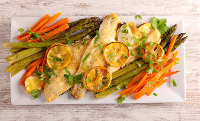Lemon fish with asparagus and carrot