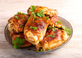 Roast chicken thighs on plate