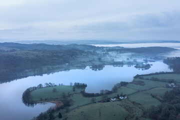 Stunning drone aerial landscape image of cloud inversion around Esthwaite Water in Lake District during Spring sunrise - 783776522