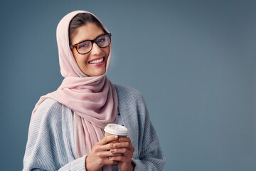 Portrait, smile and Islamic woman with coffee on studio background and girl with confidence. Face,...