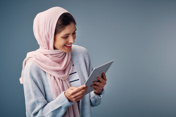Muslim, woman and reading online with tablet, ebook or streaming video to watch on web. Contact,...