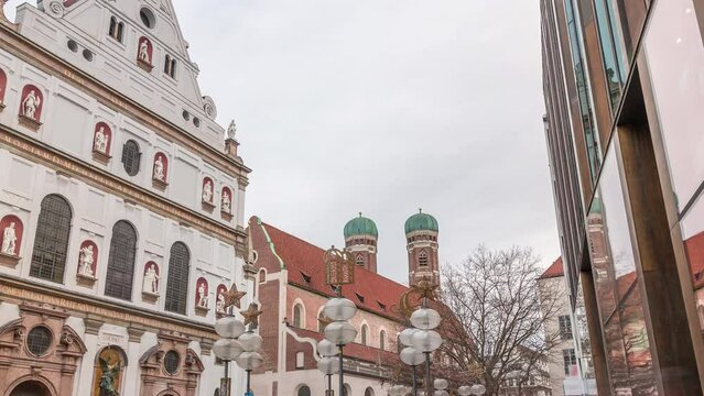 View of the St. Michael's Church and the pedestrian street of Neuhauser in centre of Munich timelapse. Walking street with many shops and relaxing area. Bavaria, Germany.