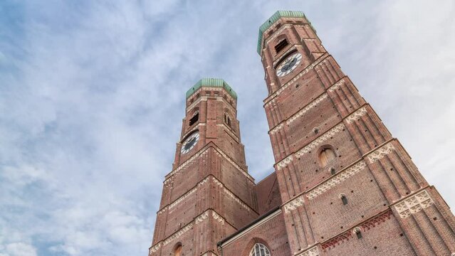 Frauenkirche Church exterior of building in Old Town Square in Munich looking up perspective timelapse. The famous church is a landmark and is considered a symbol of the Bavarian capital city. Germany