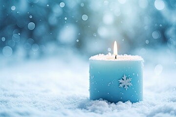 Frosty candle on snowy surface