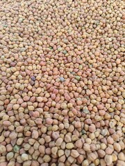 Black Chana. Heap of kala chana in a wooden bowl. Kala Chana is also known as Bengal Gram, Black Chickpeas, Brown Chickpeas. Good for making curries or sprouted and consumed in salads