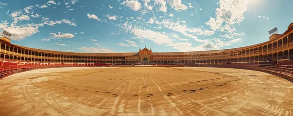 Schilderijen op glas Panoramic view of an empty bullfighting arena under blue sky © Denys