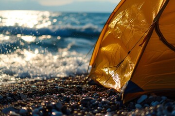 Close side view of a yellow tent on the sandy seashore at sunrise, concept of travel camping and adventure	
 - Powered by Adobe
