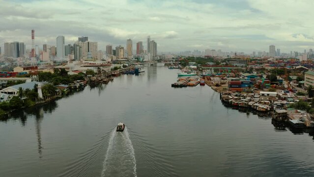 Populous city of Manila, the capital of the Philippines with skyscrapers, streets and buildings. Travel vacation concept.