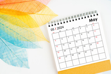 Naklejka premium May 2024 monthly desk calendar and fiber structure of dry leaves texture, skeleton leaf.
