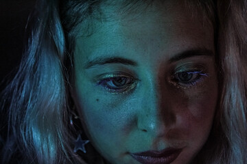 portrait of young girl in blue light